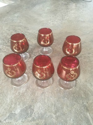 Decorative footed glasses in red and gold.