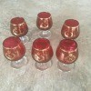 Decorative footed glasses in red and gold.