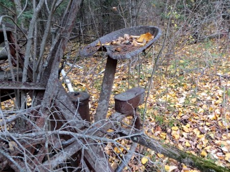 A piece of metal farm equipment.