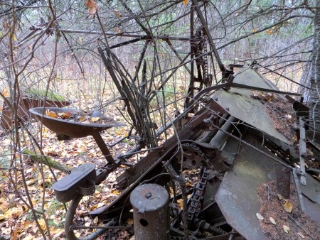 A piece of metal farm equipment.