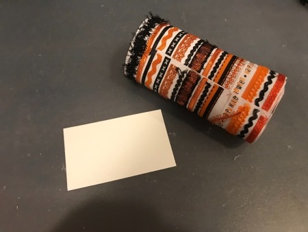 Halloween Sign - piece of white paper and Halloween or fall colored ribbon tape