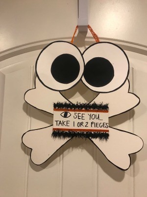 Halloween Sign - finished sign hanging on an over the door hook