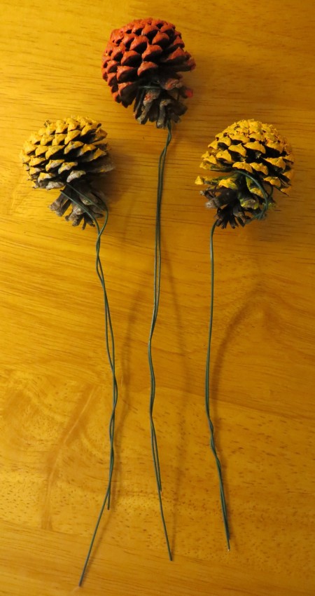 Adding stems to the pinecones to resemble zinnias.
