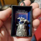 Value of a Pewter Thimble? - Churchill Downs thimble with jockey and building on the thimble