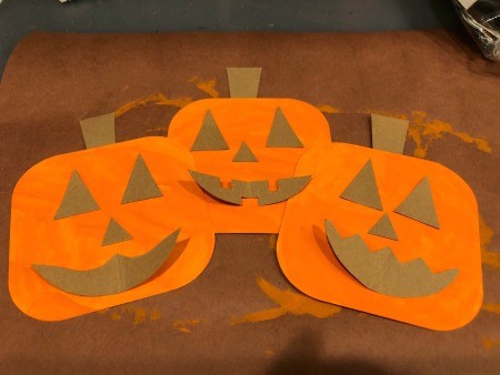 Pumpkin Wall Decoration - three pumpkins with faces partially glued in place