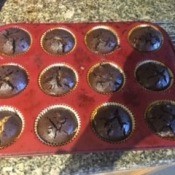 A muffin tray with baked peanut butter brownie cups.
