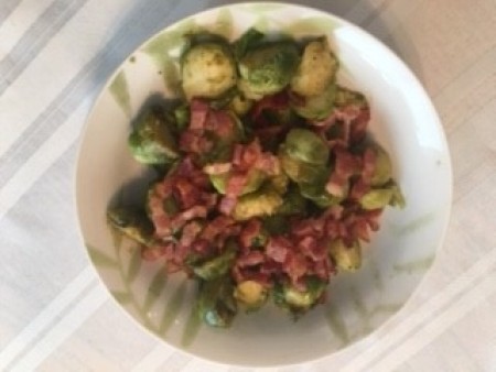 A plate of roasted Brussels sprouts on a plate.