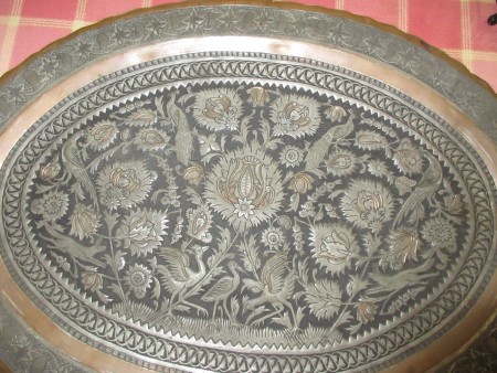 Close up of the design on a copper platter.