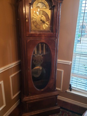 A grandfather clock in a corner.