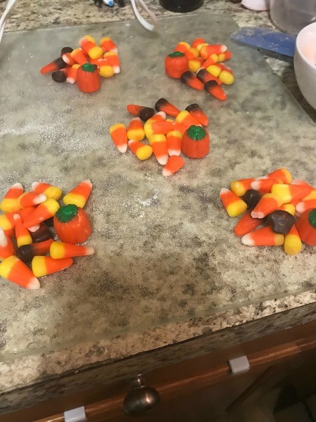 Piles of candy for each cookie.