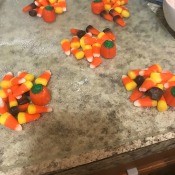 Piles of candy for each cookie.