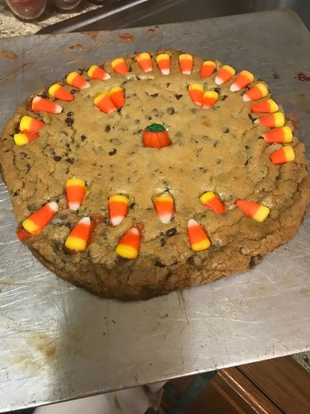 A decorated giant chocolate cookie.