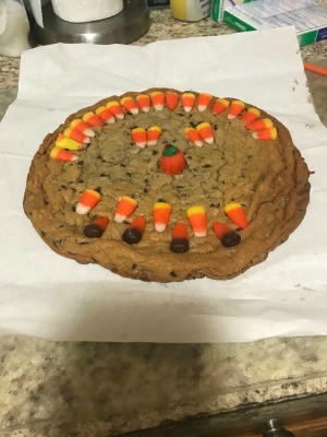 A decorated giant chocolate cookie.