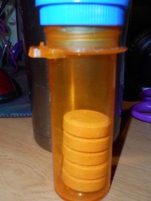 Sugar pills being stored in a prescription pill bottle.
