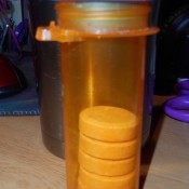 Sugar pills being stored in a prescription pill bottle.