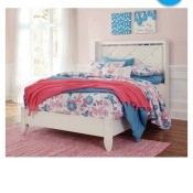 A white bed in an advertisement.