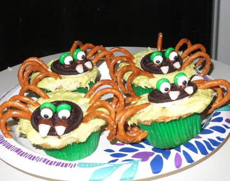 Cupcakes decorated to resemble spiders.