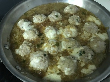 Meatballs in French onion sauce.