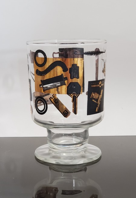 A decorative black and gold glass.