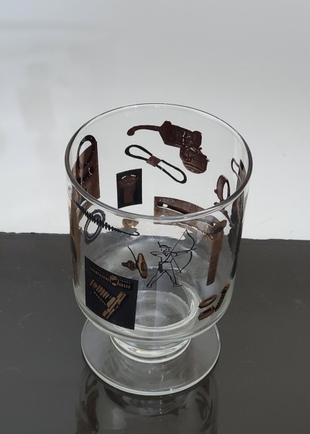 A decorative black and gold glass.