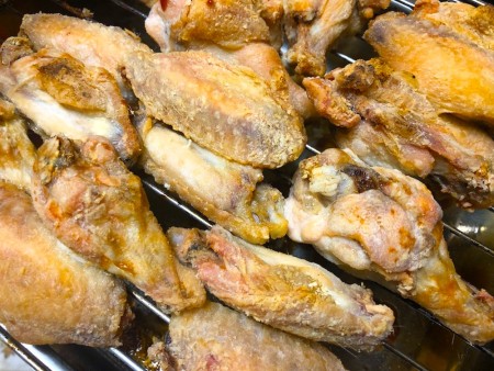 A tray of cooked chicken wings.
