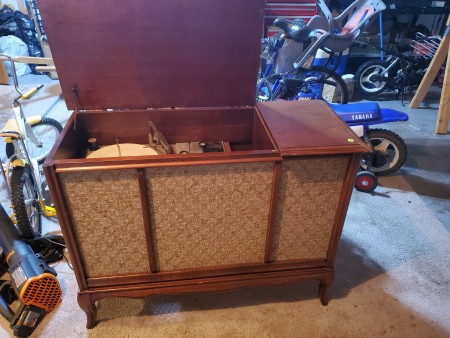 An open Sylvania stereo cabinet.