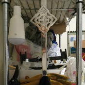 A wreath hanger holding up a cleaning towel.