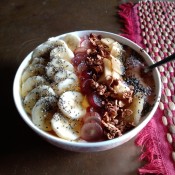 A healthy acai bowl with lots of fruits and toppings.