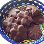 A bowl of handmade flower shaped chocolates.