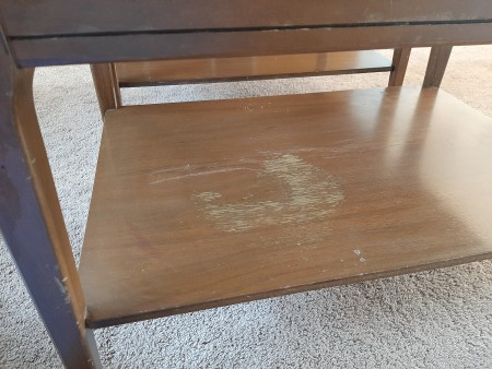 The lower shelf of a Mersman end table.