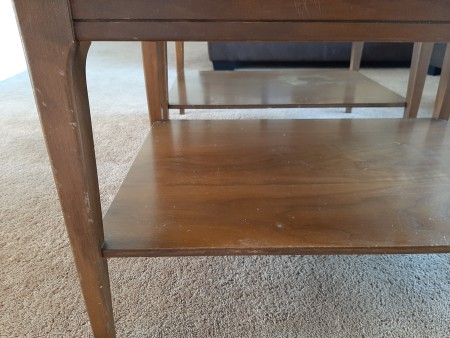 The lower shelf of a Mersman end table.