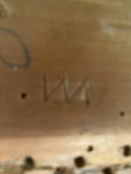 A marking on the bottom of a chair.