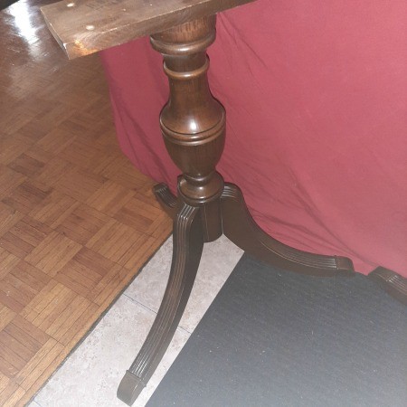 The pedestal leg from a table.