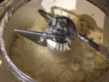 Mixing up the mashed potatoes in a food processor.