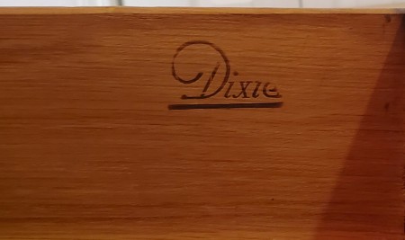 The Dixie marking on the furniture.
