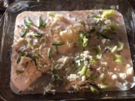 Adding the ingredients to a baking pan.