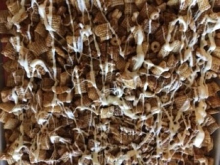 The gingerbread Chex mix drizzled with white chocolate.