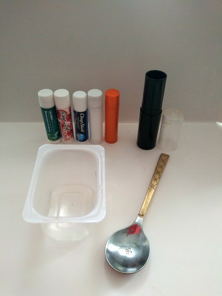 Large Lip Balm - oid lip balm tubes, plastic baby food container and a spoon