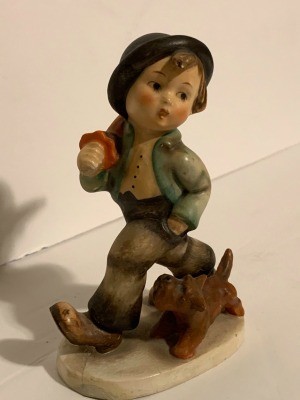 A Hummel figurine of a boy.