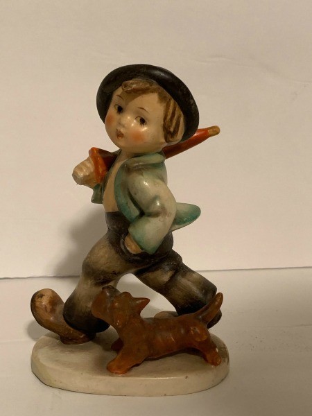 A Hummel figurine of a boy.