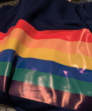 A rainbow stripe on a shirt.