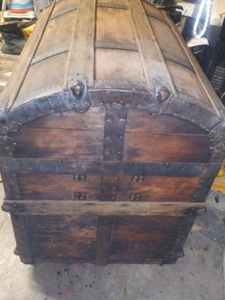The side of a wooden chest.