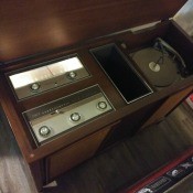 A stereo console with a turntable.