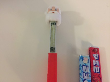 A rolled bill inside a Pez dispenser.