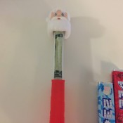 A rolled bill inside a Pez dispenser.