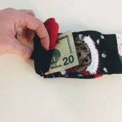 Rolling a $20 bill into a sock.