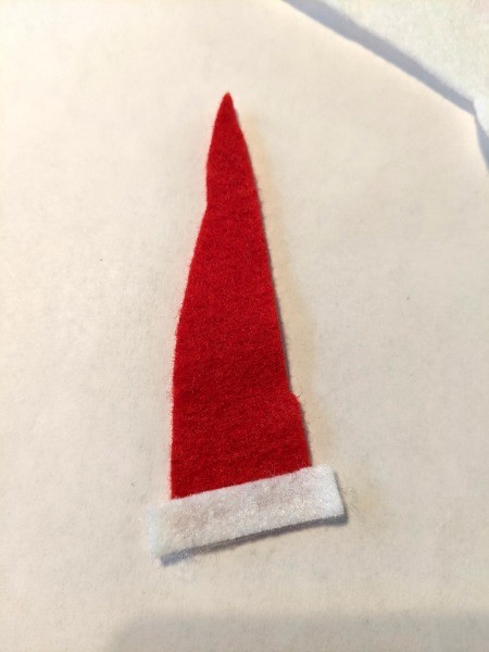 Christmas Dino Decoration - white strip glued to the conical red hat