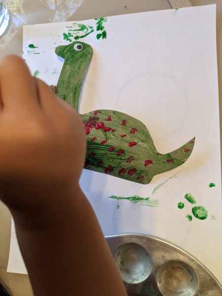 Christmas Dino Decoration - adding red spots, eye glued in place