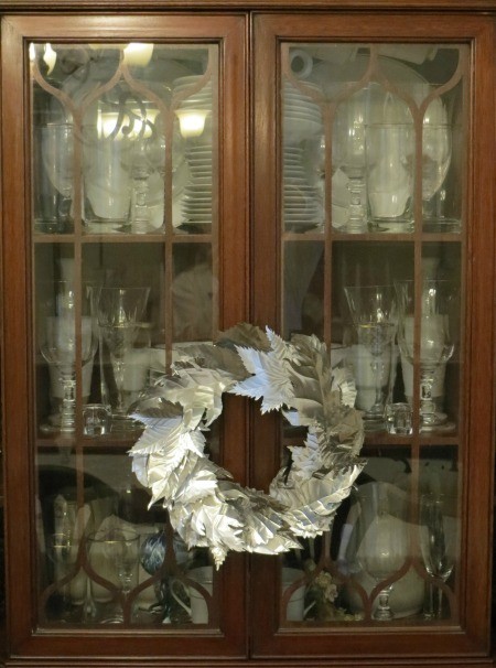 Candle Ring - as a wreath on the front of a china cabinet
