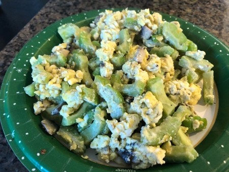 A completed plate of Chinese Bitter Melon Scrambled Eggs with Mushroom